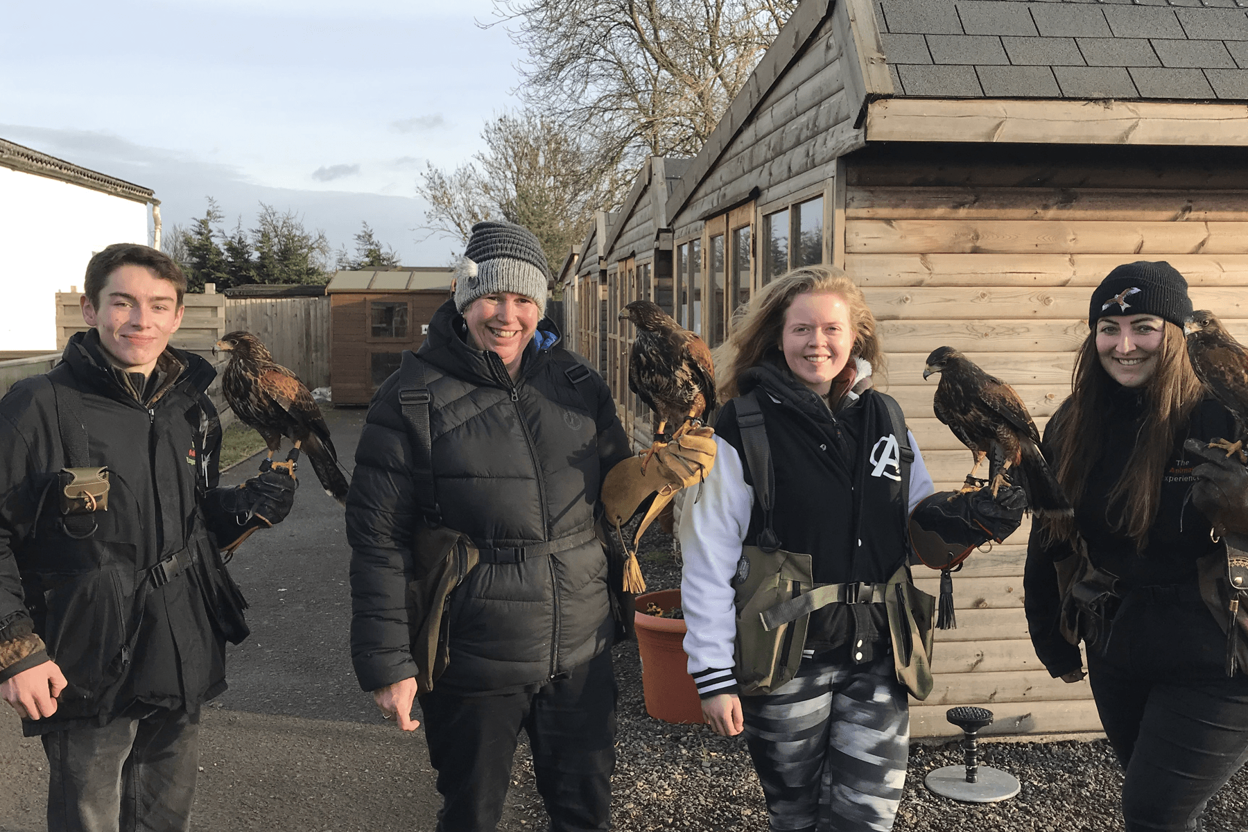 Things to do in East Cambridgeshire - The Animal Experience - Smiling visitors holding birds of prey