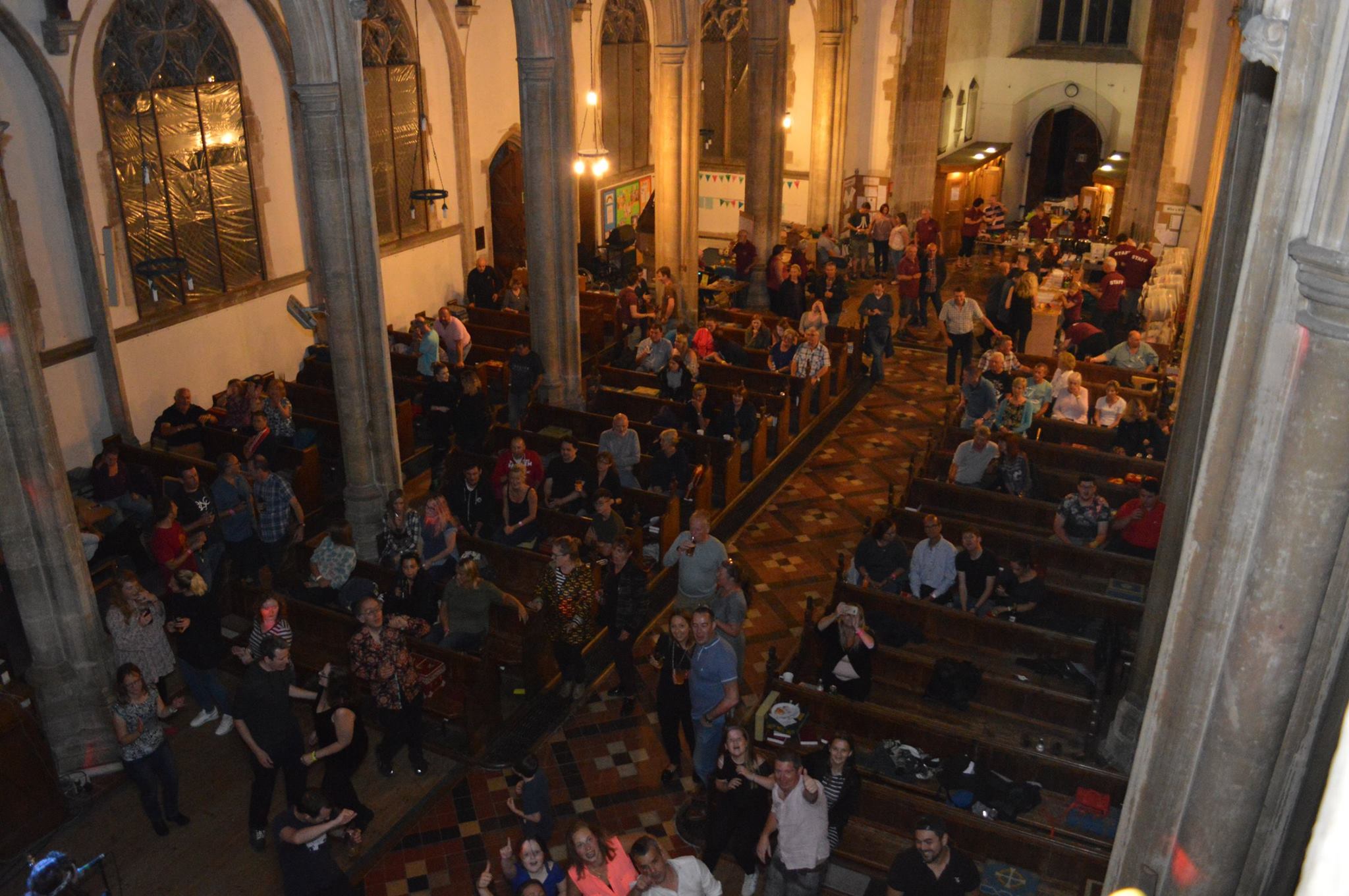 Things to do in East Cambs in Winter - Sutton Winter Beer Festival. Attendees at festival waving up into camera