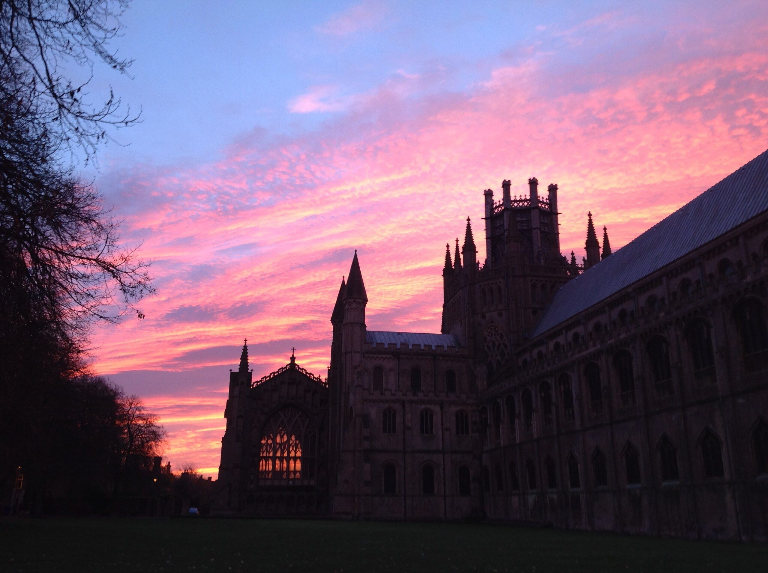 Things to do in East Cambridgeshire - Ely Cathedral at night with sunset in background